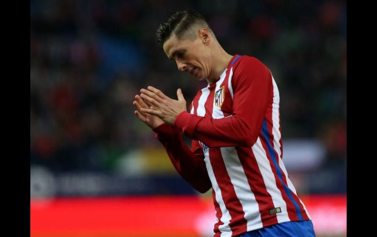 El ''Niño'' Torres celebra la diana que le da la victoria al equipo de la capital española. AFP / C. Manso