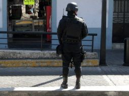 Policías se encargan de la investigación para dar con los perpetradores del asalto. EL INFORMADOR / ARCHIVO