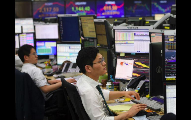 Los inversionistas asignan una probabilidad de 100% de aumento de tasas esta semana. AFP /  Y. Jung