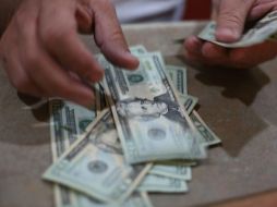 Para este día, se estima que el tipo de cambio cotice entre 19.50 y 19.70 pesos por dólar. EL INFORMADOR / ARCHIVO