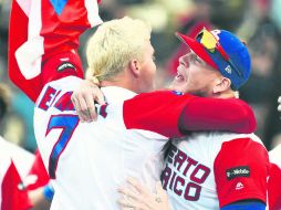 Jugadores de la Selección de Puerto Rico celebran la sufrida victoria ante Holanda y el boleto a la Final del CMB. AFP /  J. Kamin