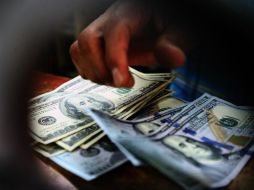 Se prevé que el peso cotice entre 18.90 y 19.05 pesos por dólar en transacciones interbancarias a la venta. EL INFORMADOR / ARCHIVO