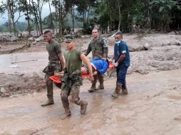 La televisión local trasmite imágenes de la región afectada por la avalancha de lodo y piedras que arrasó con todo. ESPECIAL / XINHUA