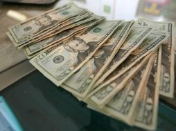 La institución financiera, prevé que para este viernes el tipo de cambio cotice entre 18.65 y 18.80 pesos por dólar. EL INFORMADOR / ARCHIVO