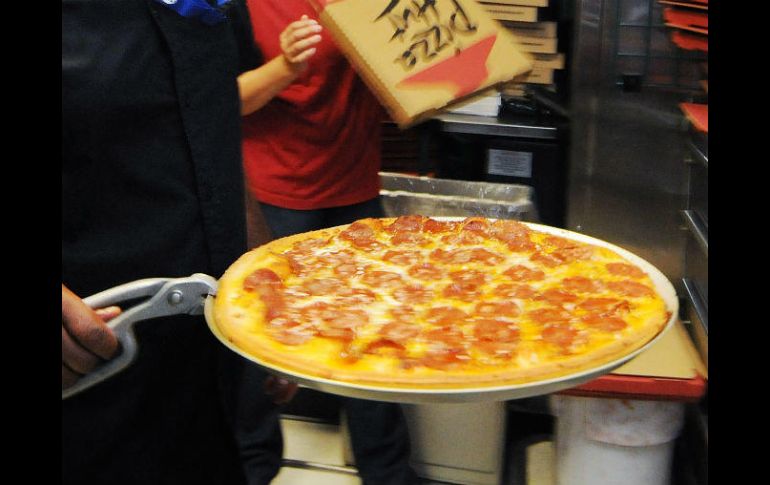 Supuestos repartidores ofrecen pizzas 'canceladas' en la Ciudad de México. AP / ARCHIVO