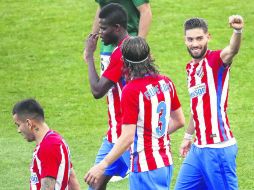 Dos de cal por una de arena. Yannick Carrasco marcó dos goles para el Atlético de Madrid, pero falló un penalti. EFE /