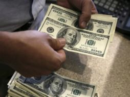 De acuerdo con el Banco de México el tipo de cambio es de 18.5582 pesos. AP / ARCHIVO