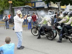 Maduro sostiene que las protestas buscan crear condiciones para un golpe de Estado y una intervención extranjera. AFP / F. Parra