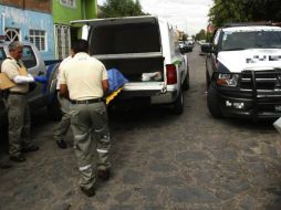 La PGJE traslada los restos humanos al Servicio Médico Forense de la capital michoacana. EL INFORMADOR / ARCHIVO