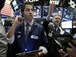 Wall Street cerró mixto tras la votación de la reforma sanitaria en el Congreso. AP / R. Drew