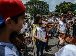 Artistas en protesta. La marcha finalizó con un concierto en homenaje a los fallecidos durante las protestas. AFP / J. Barreto