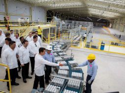 La planta en Hunucmá producirá cinco marcas del corporativo. El presidente Peña Nieto estuvo presente en su inauguración. EFE / Presidencia