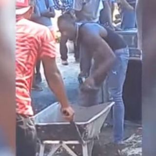 Usain Bolt ayuda a cavar tumba de medallista recién fallecido