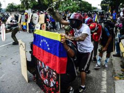 En más de tres meses de protestas, la oposición contabiliza un centenar de muertos y más de cuatro mil personas detenidas. AFP / R. Schemidt