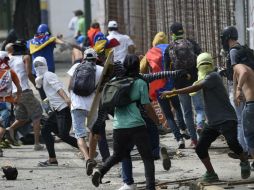 Suman 105 los muertos y más de mil detenidos tras cuatro meses de protestas en Venezuela. AFP / J. Barreto