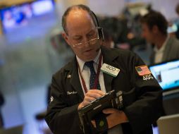 El índice industrial inició el día con una ganancia de 61.10 puntos y se ubicaba en 22 mil 025.02 unidades. AP / B. R. Smith