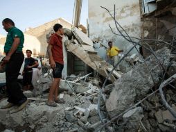 Al menos tres viviendas se incendiaron como consecuencia de uno de los ataques. AFP / ARCHIVO