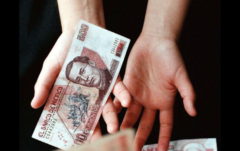 La calificadora destaca la reciente apreciación del peso y la consolidación fiscal. NTX / ARCHIVO