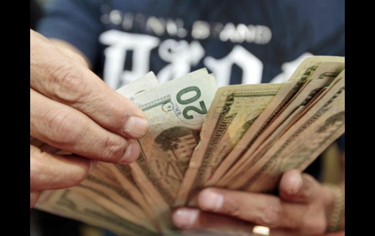 El Banxico fijó en 17.8733 pesos el tipo de cambio para solventar obligaciones denominadas en moneda extranjera. EL INFORMADOR / ARCHIVO