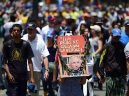 Opositores salen a las calles en protesta por las recientes aprehensiones de funcionarios contrarios al Gobierno de Nicolás Maduro. AFP / R. Schemidt