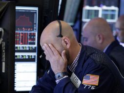 El índice Dow Jones registraba a la apertura de este lunes una baja de 133.02 puntos  y se ubicaba en 21 mil 991.34 unidades. AP / ARCHIVO