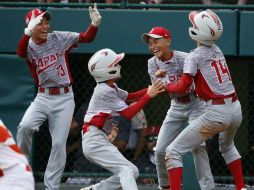 El partido terminó en la baja de la quinta entrada, una vez que Japón se despegó por 10 carreras. AP / G.J. Puskar