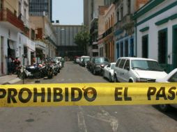 La Fiscalía General del Estado encabezó las diligencias necesarias para el procesamiento de la escena, y levantamiento de los cuerpos. EL INFORMADOR / ARCHIVO