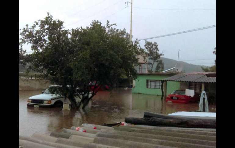 Vehículos y viviendas afectados por las lluvias. NTX / ESPECIAL