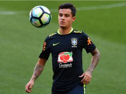 Philippe Coutinho se prepara con la Selección de Brasil para enfrentar a Ecuador mañana en partido de clasificación al Mundial. AFP / N. Almeida