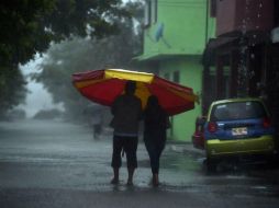 Las intensas lluvias que ya deja 'Katia' han provocado afectaciones menores en 17 municipios. AFP / Y. Cortez