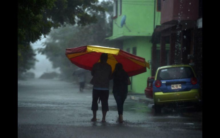 Las intensas lluvias que ya deja 'Katia' han provocado afectaciones menores en 17 municipios. AFP / Y. Cortez