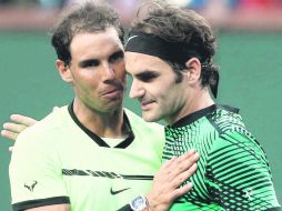 Rafael Nadal y Roger Federer han marcado toda una época dentro del tenis en el nuevo milenio. AFP /