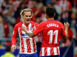 'Grizou' (D) inscribe su nombre en la historia del Atlético. AFP / O. del Pozo