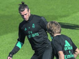 Van con todo. Gareth Bale y Luka Modric se preparan para recibir al Real Betis en el Santiago Bernabéu. EFE /