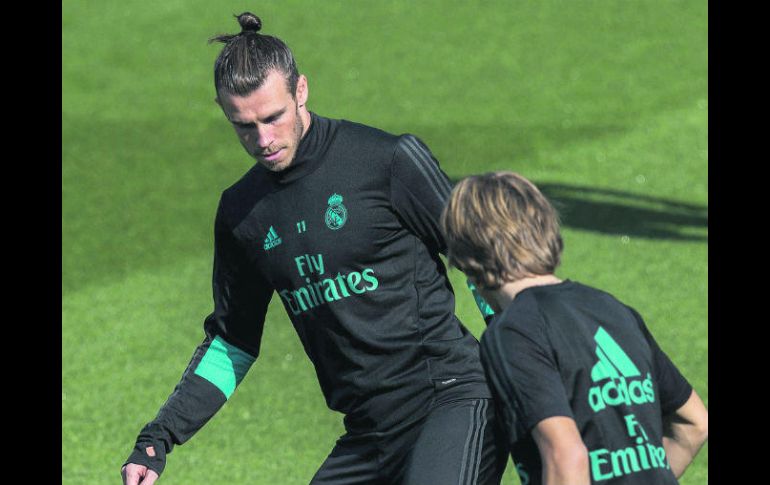 Van con todo. Gareth Bale y Luka Modric se preparan para recibir al Real Betis en el Santiago Bernabéu. EFE /
