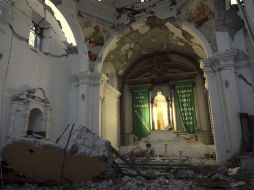 En la población de Atzala, tres familias perdieron a 11 integrantes tras encontrarse en el interior de un templo. AP / P. Spencer