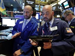 La sesión de este jueves estuvo marcada por la publicación de los resultados de dos colosos bancarios de Wall Street. AP/R. Drew