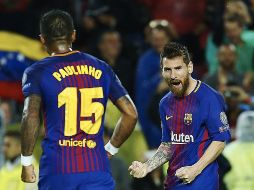 El argentino (D) necesitó 21 partidos menos que Cristiano Ronaldo para llegar al centenar de goles europeos. EFE/ A. García