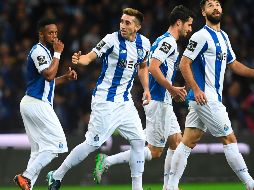 La victoria permite a los Dragones mantenerse en la cima de la Primeira Liga. AFP/F. Leong