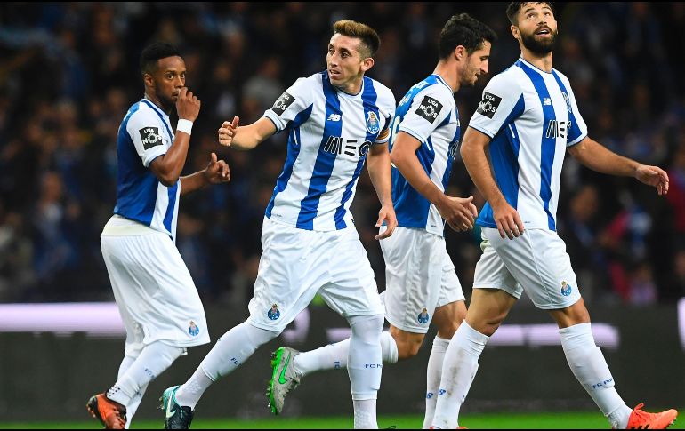 La victoria permite a los Dragones mantenerse en la cima de la Primeira Liga. AFP/F. Leong