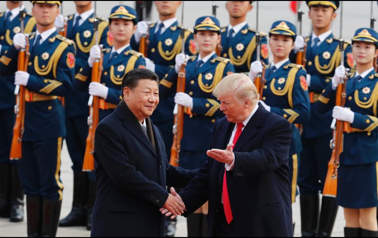 En sus primeras horas en la capital china, Donald Trump saludó al presidente Xi Jinping. AP/A. Wong