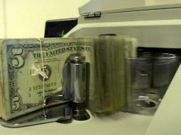 Prevén que el tipo de cambio cotice entre un rango de 18.40 y 18.58 pesos por dólar. AP / ARCHIVO