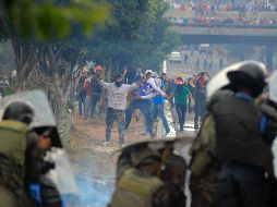 La Alianza de Oposición contra la Dictadura alega ser víctima de fraude electoral. Sus manifestaciones han sido aprovechadas por saqueadores. EFE/F. Morazán