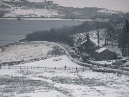 Advierten que ciertas zonas rurales, especialmente en Gales y el oeste de Inglaterra, pueden quedar incomunicadas por la nieve. AFP/O. Scarff