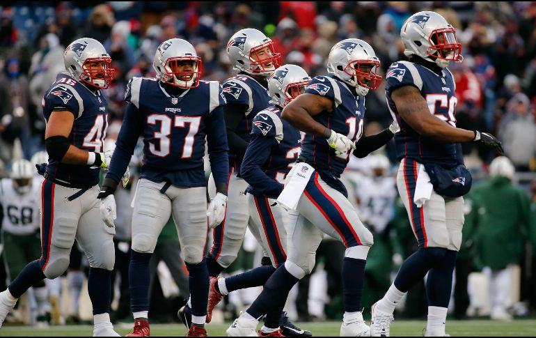El triunfo garantizó la séptima campaña con al menos 13 victorias para los Patriots (13-3). AFP / J. Rogash