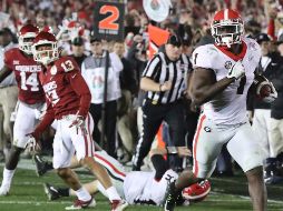 Un acarreo de 27 yardas de Sony Michel para touchdown en doble tiempo extra dio a Georgia la victoria. AP / C. Compton/Atlanta Journal-Constitution