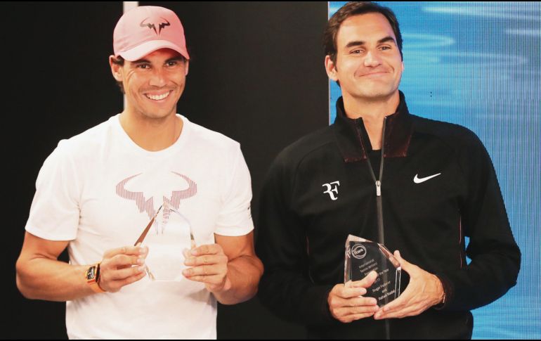 Sonrientes. Rafael Nadal, número uno del mundo, y Roger Federer, campeón defensor, inician su andar en el primer Grand Slam del año. EFE/M. Irham