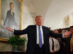 El mandatario asegura que pagar el muro es una insignificancia en comparación con lo que México gana de EU con el TLCAN. AP / ARCHIVO