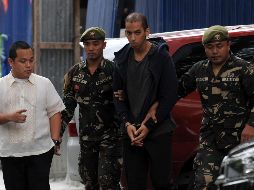 Soldados escoltan a Abdelhakim Labidi Adib a su llegada al Departamento de Justicia. AFP