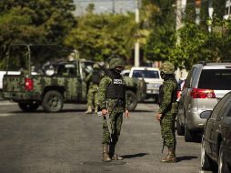 Elementos de la Policía Estatal, del Ejército y de la Marina son desplegados en la ciudad tamaulipeca con el objetivo de despejar las vialidades. EL INFORMADOR / ARCHIVO